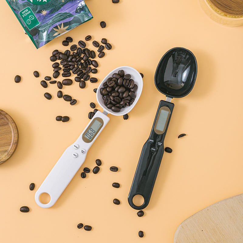 LCD Digital Spoon Scale UK with coffee beans on an orange background for precise measuring in cooking.