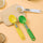 LCD Digital Spoon Scale UK with colorful measuring spoons on a kitchen countertop for precise cooking measurements.